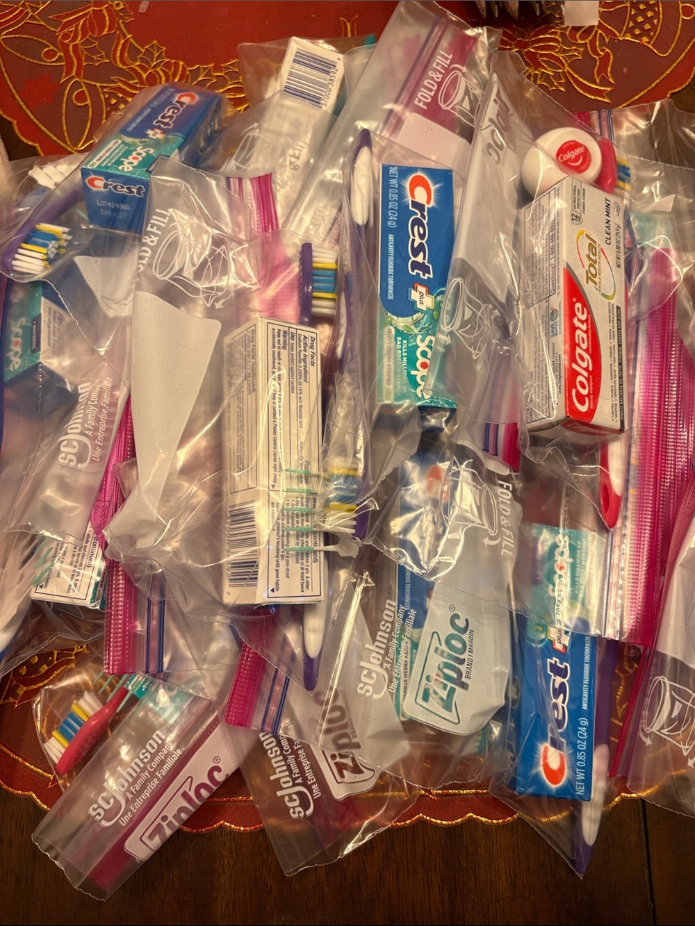 11 sets of toothbrushes/toothpaste/floss PLUS 2 x Value packs of tooth brushes